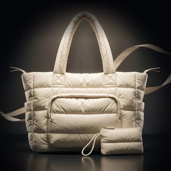 The Cloud Puffer quilted nylon tote under a single spotlight, a frame from the film above